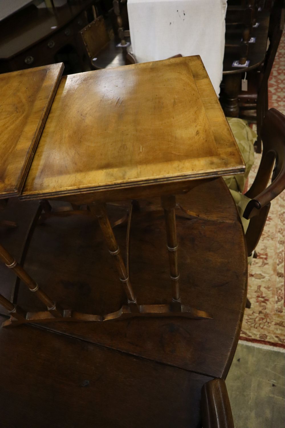 Three rectangular walnut occasional tables (formerly a nest of tables), largest width 50cm, depth 34cm, height 56cm